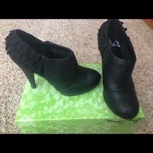 Black heel bootie with ruffle